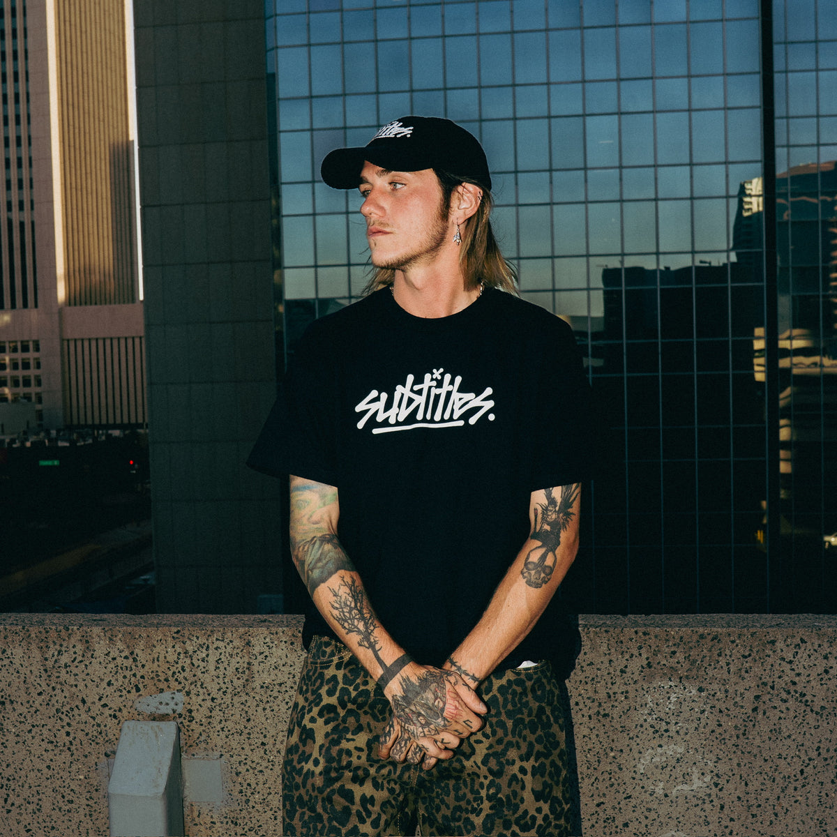 subtitles. Tour Tee