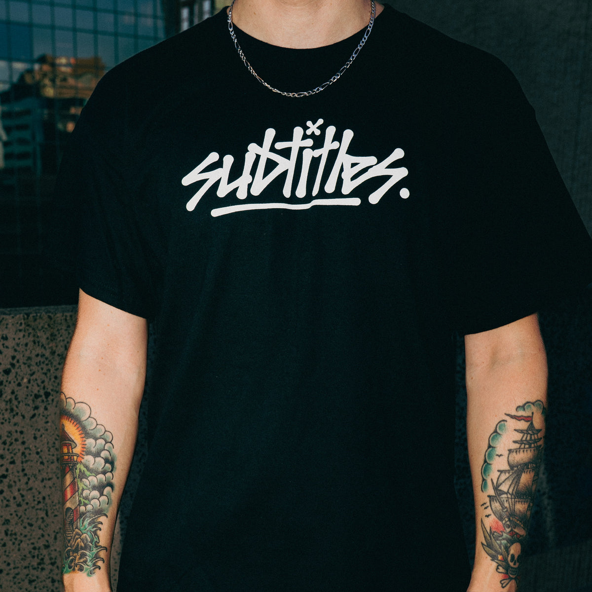 subtitles. Tour Tee